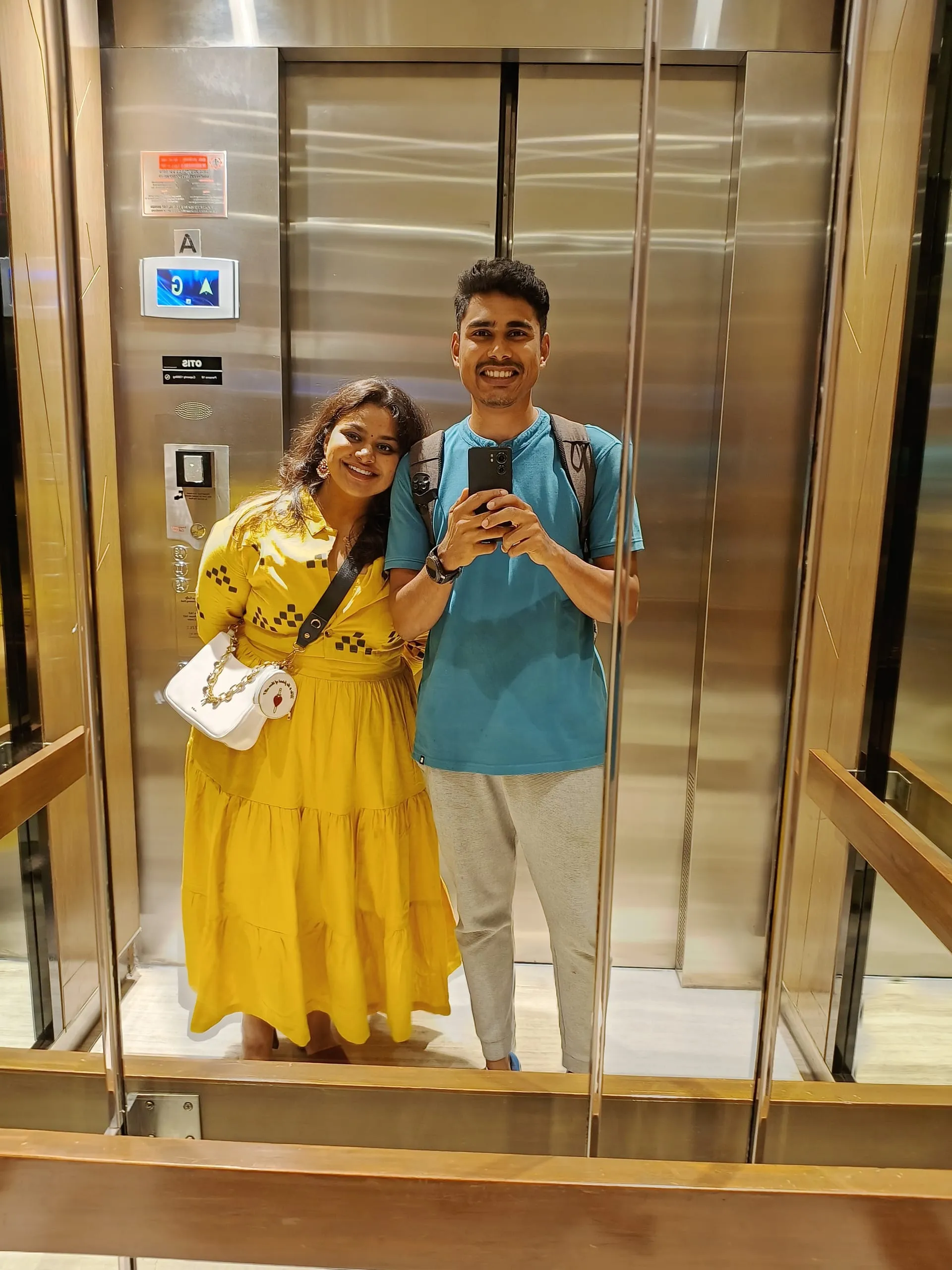 An elevator mirror selfie, 2023