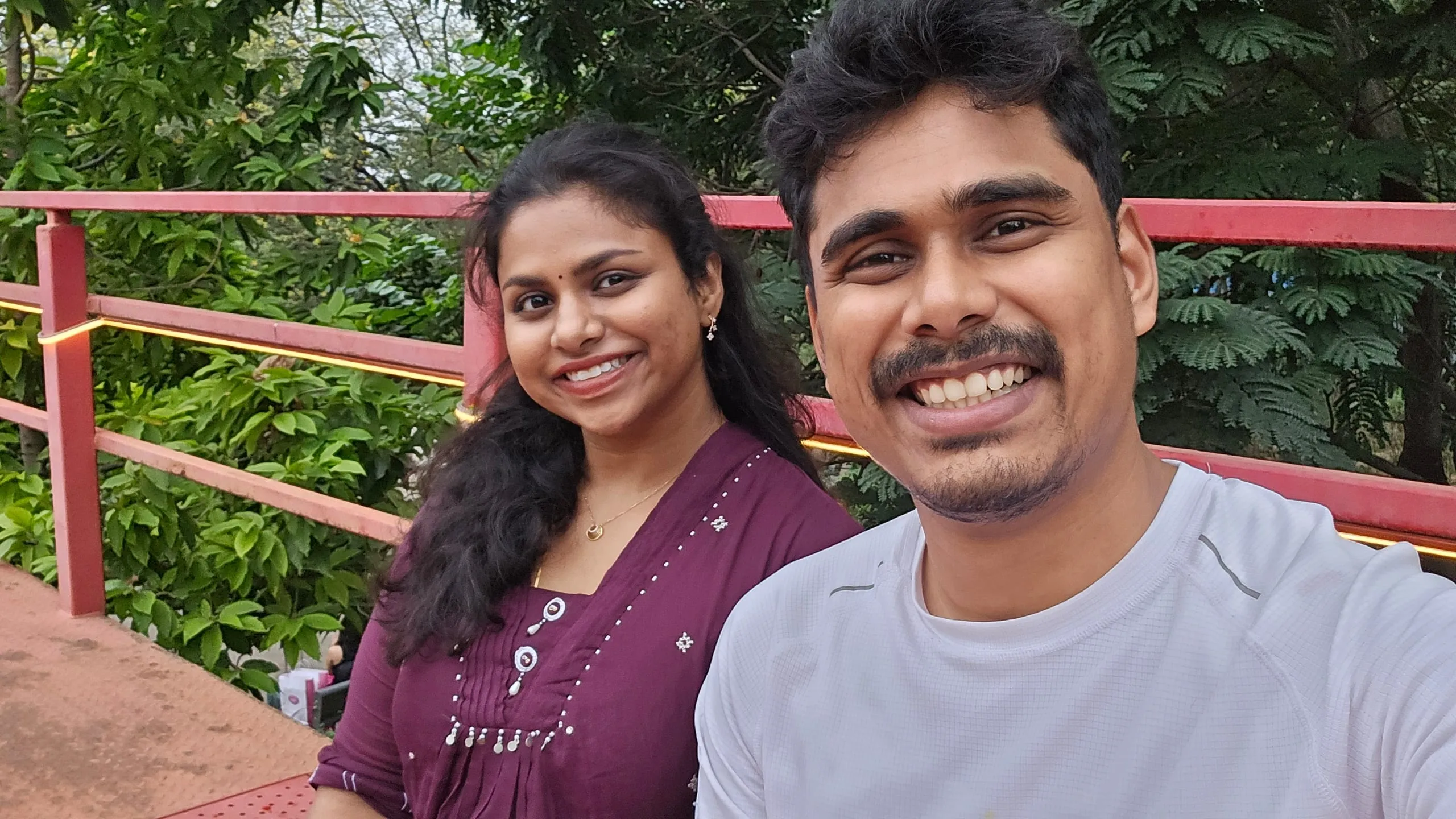 Swathi and Gautham laughing outdoors