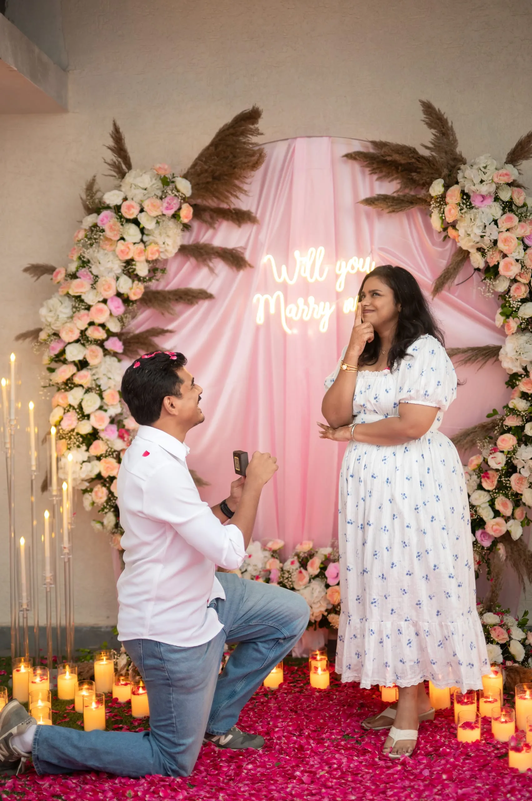 On one knee.