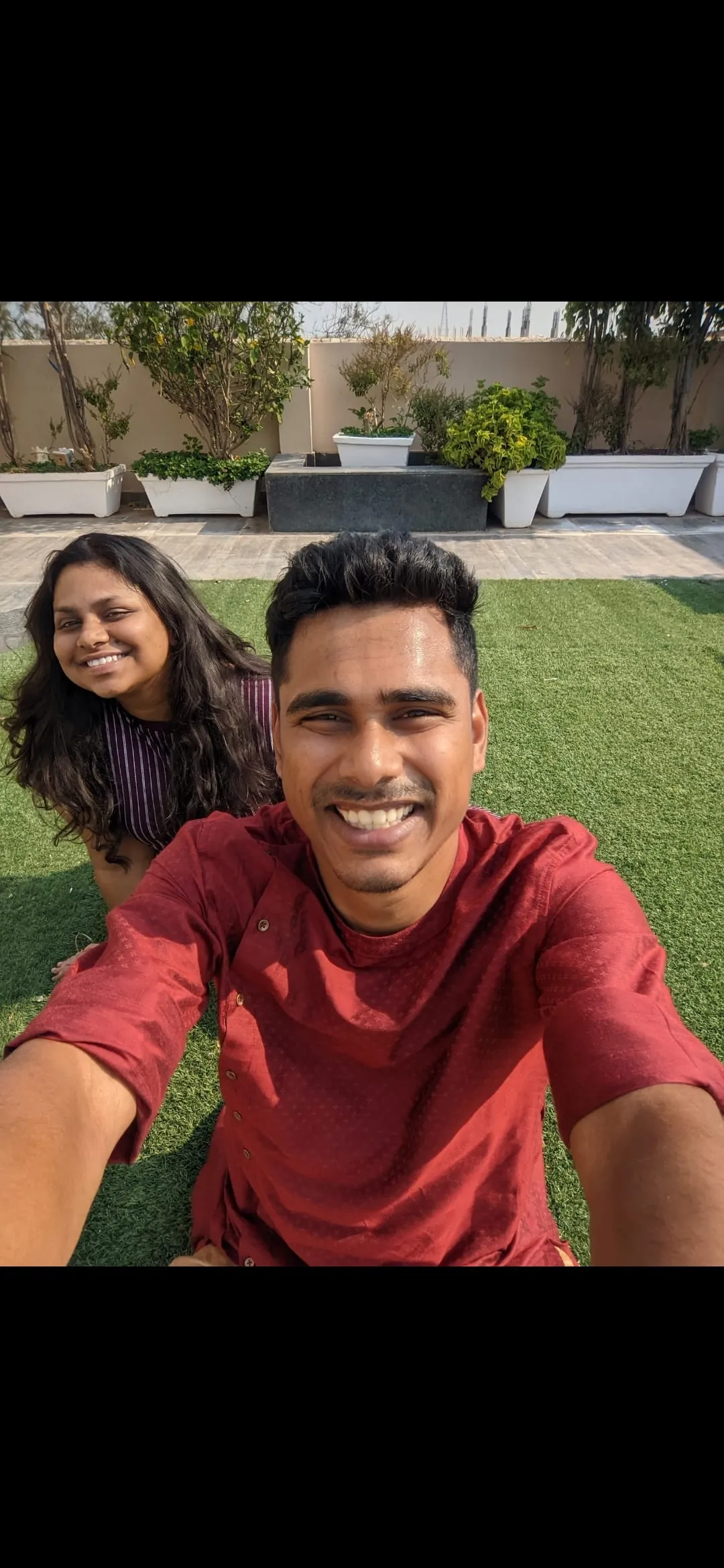 A sunny selfie of Swathi and Gautham outdoors